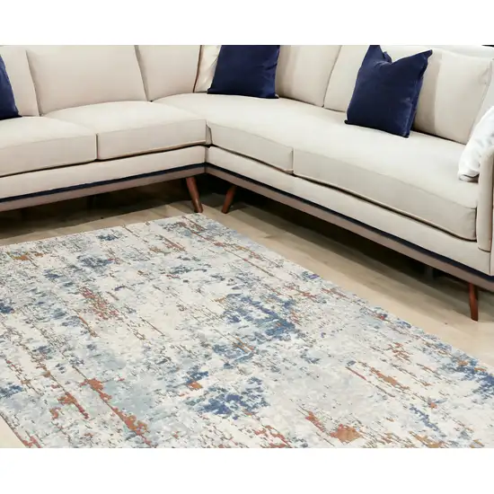 Beige And Blue Abstract Area Rug Photo 1