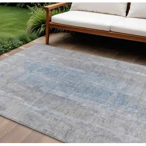 Photo of Beige And Blue Abstract Washable Indoor Outdoor Area Rug