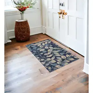 Photo of Beige And Blue Botanical Leaves Area Rug