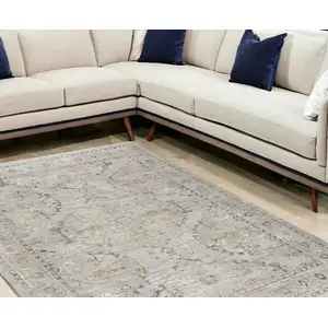 Photo of Beige And Blue Floral Medallion Distressed Area Rug With Fringe