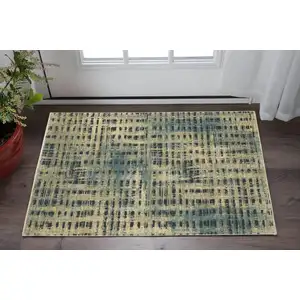 Photo of Beige And Blue Geometric Area Rug