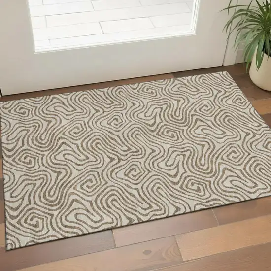 Beige And Brown Abstract Washable Area Rug With UV Protection Photo 1