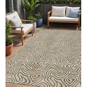 Photo of Beige And Brown Abstract Washable Indoor Outdoor Area Rug