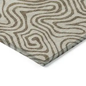 Photo of Beige And Brown Abstract Washable Indoor Outdoor Area Rug