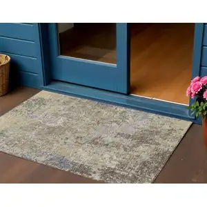 Photo of Beige And Brown Abstract Washable Indoor Outdoor Area Rug