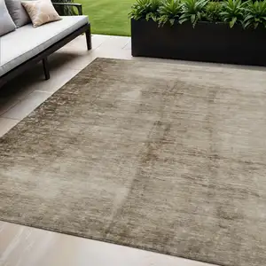Photo of Beige And Brown Abstract Washable Indoor Outdoor Area Rug