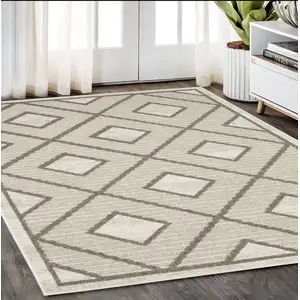 Photo of Beige And Brown Geometric Area Rug