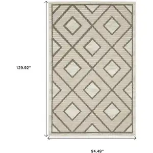 Photo of Beige And Brown Geometric Area Rug