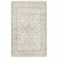 Photo of Beige And Charcoal Oriental Hand Loomed Stain Resistant Area Rug With Fringe