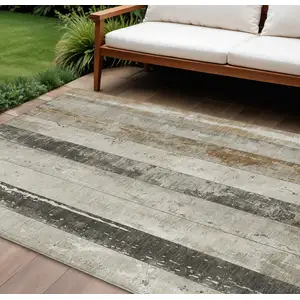 Photo of Beige And Charcoal Striped Washable Indoor Outdoor Area Rug