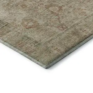 Photo of Beige And Coral Oriental Washable Area Rug With UV Protection