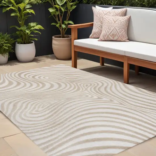 Beige And Cream Abstract Indoor Outdoor Area Rug Photo 1