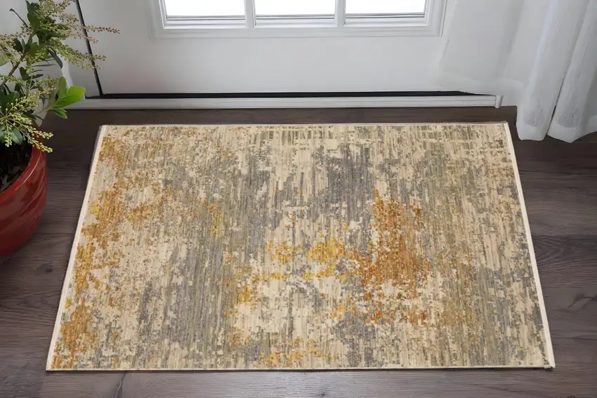 Beige And Gold Abstract Area Rug With Fringe Photo 1