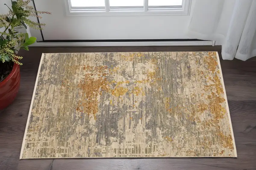 Beige And Gold Abstract Area Rug With Fringe Photo 1