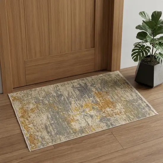Beige And Gold Abstract Area Rug With Fringe Photo 1