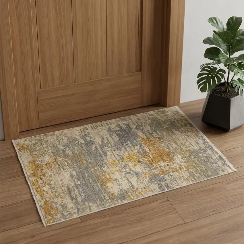 Beige And Gold Abstract Area Rug With Fringe Photo 1