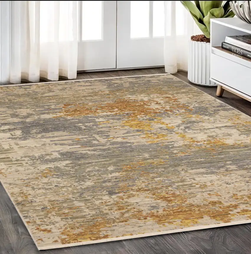 Beige And Gold Abstract Area Rug With Fringe Photo 1
