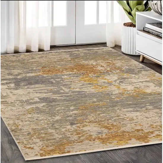 Beige And Gold Abstract Area Rug With Fringe Photo 1
