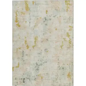 Photo of Beige And Gold Abstract Washable Indoor Outdoor Area Rug