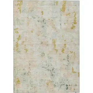 Photo of Beige And Gold Abstract Washable Indoor Outdoor Area Rug