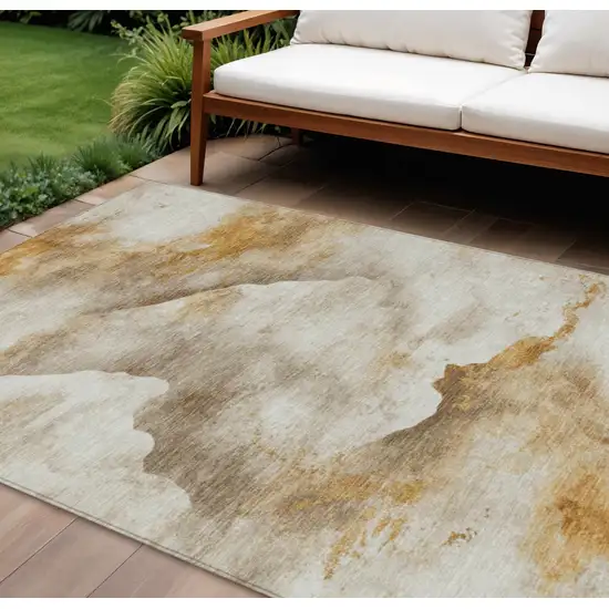 Beige And Gold Abstract Washable Indoor Outdoor Area Rug Photo 2