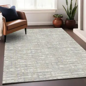 Photo of Beige And Gray Abstract Washable Indoor Outdoor Area Rug