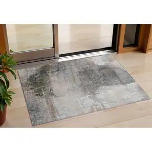 Photo of Beige And Gray Abstract Washable Indoor Outdoor Area Rug
