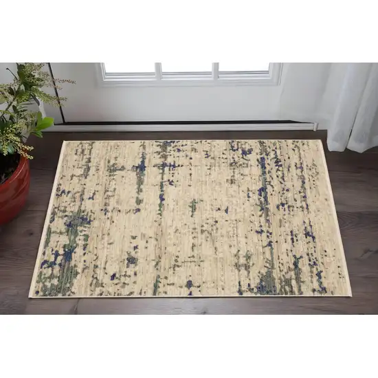 Beige And Green Abstract Area Rug With Fringe Photo 1