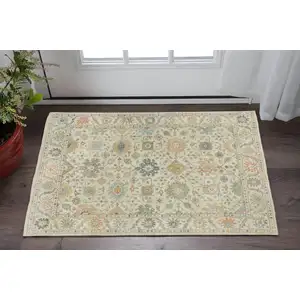 Photo of Beige And Green Wool Oriental Hand Knotted Area Rug With Fringe