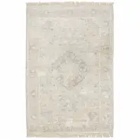 Photo of Beige And Grey Oriental Hand Loomed Stain Resistant Area Rug With Fringe