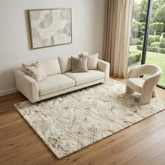 Beige And Ivory Abstract Area Rug Photo 1