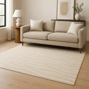Photo of Beige And Ivory Abstract Shag Area Rug