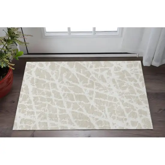 Beige And Ivory Abstract Washable Area Rug With UV Protection Photo 2