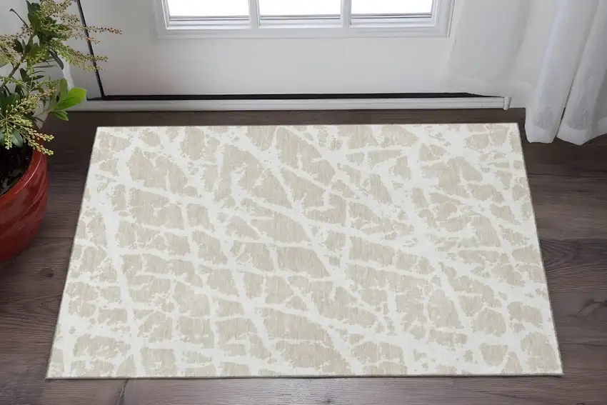 Beige And Ivory Abstract Washable Area Rug With UV Protection Photo 2