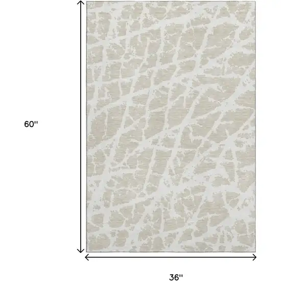 Beige And Ivory Abstract Washable Area Rug With UV Protection Photo 3