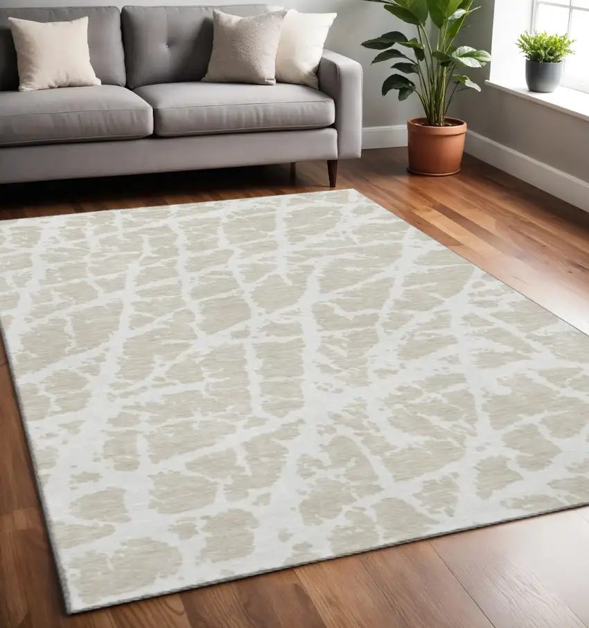 Beige And Ivory Abstract Washable Area Rug With UV Protection Photo 2