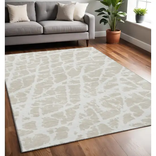 Beige And Ivory Abstract Washable Area Rug With UV Protection Photo 2