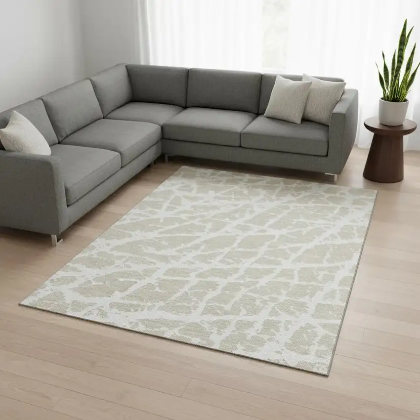 Beige And Ivory Abstract Washable Area Rug With UV Protection Photo 1
