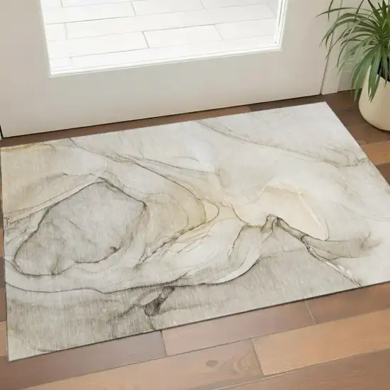 Beige And Ivory Abstract Washable Area Rug With UV Protection Photo 1