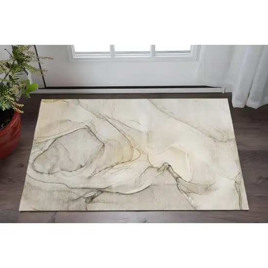 Beige And Ivory Abstract Washable Area Rug With UV Protection Photo 2