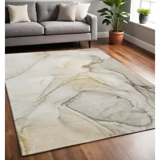 Beige And Ivory Abstract Washable Area Rug With UV Protection Photo 2
