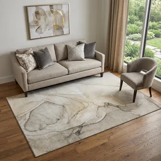 Beige And Ivory Abstract Washable Area Rug With UV Protection Photo 1