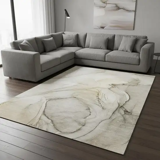 Beige And Ivory Abstract Washable Area Rug With UV Protection Photo 1
