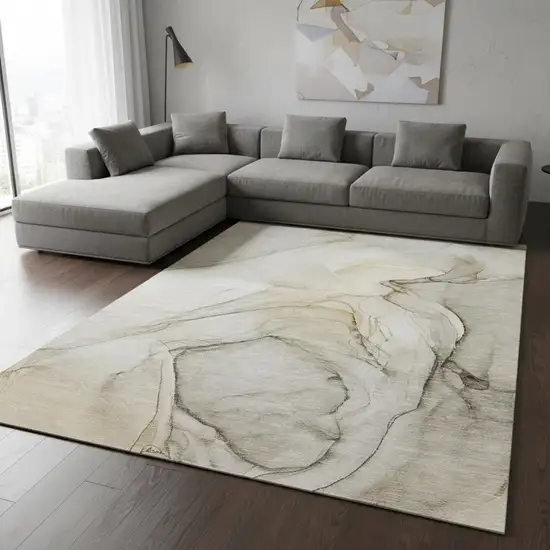 Beige And Ivory Abstract Washable Area Rug With UV Protection Photo 1