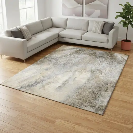 Beige And Ivory Abstract Washable Area Rug With UV Protection Photo 1