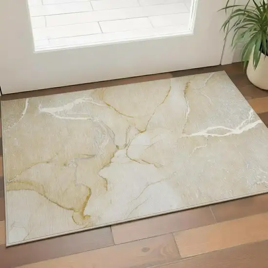 Beige And Ivory Abstract Washable Area Rug With UV Protection Photo 1