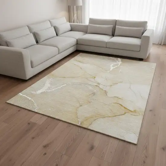 Beige And Ivory Abstract Washable Area Rug With UV Protection Photo 1