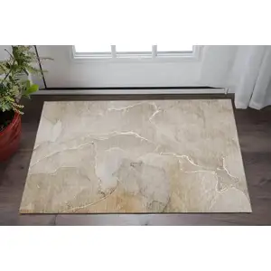 Photo of Beige And Ivory Abstract Washable Area Rug With UV Protection