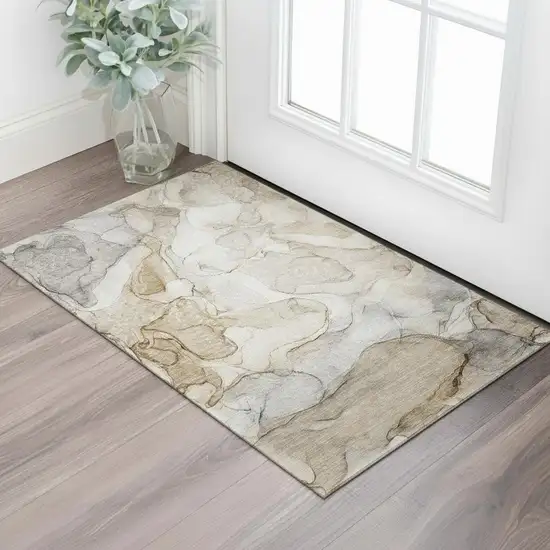 Beige And Ivory Abstract Washable Area Rug With UV Protection Photo 1