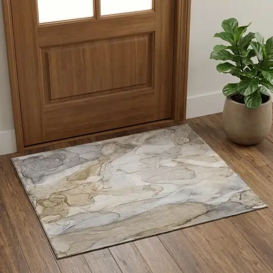 Beige And Ivory Abstract Washable Area Rug With UV Protection Photo 1